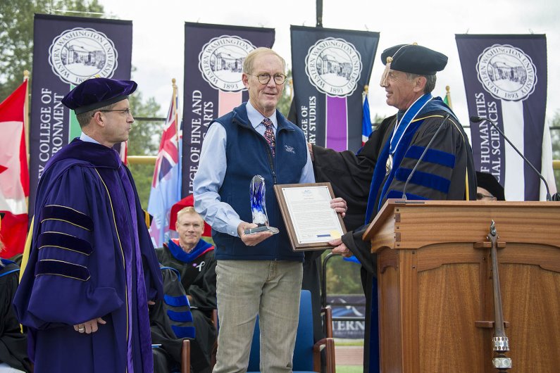Bruce Shepard gives a President’s Award to Dennis Madsen for his service to Western and to the community. Photo by Dan Levine / for WWU