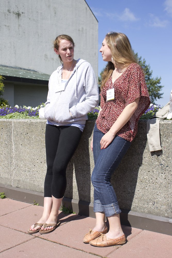 Western freshmen Molly Martin and Jeanie Marinella chat Monday, Aug. 1, in the PAC Plaza. Both from Shoreline. Martin says she wanted to go to Western because of its education program. “Western has a great music program,” Marinella adds. Photo by Christop