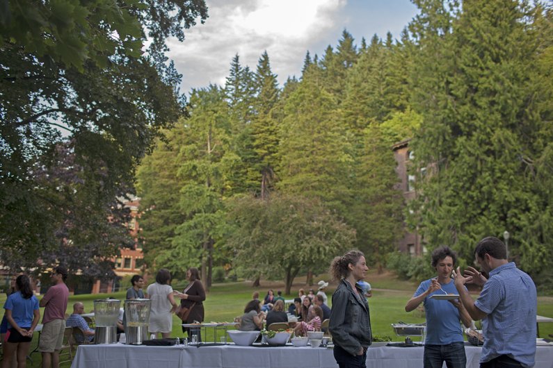Philosophy scholars from across the country start things off with a barbecue in front of Old Main Sunday, August 2. Foreground (left to right): Maya Eddon from the University of Massachusetts, Mike Titelbaum of the University of Wisconsin, and Chris Amher