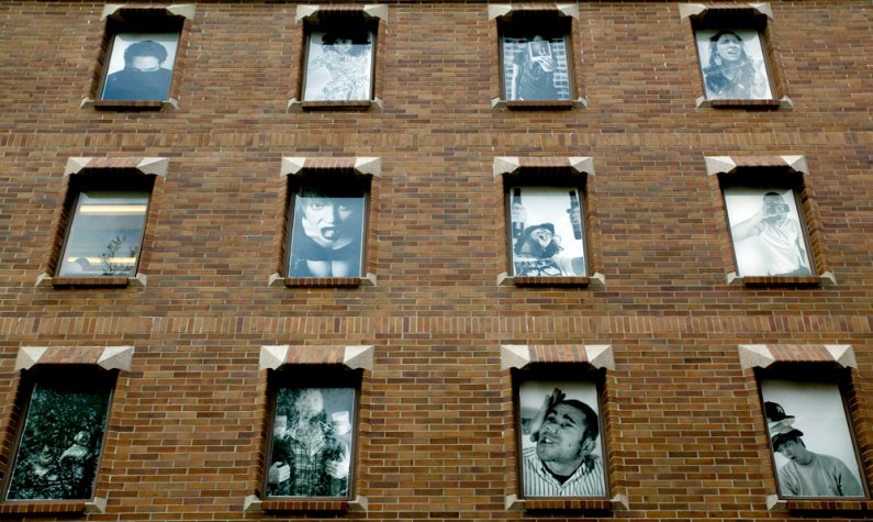 These images displayed in the windows of the Wilson Library on the Western Washington University campus are part of the "Questioning the Archive" exhibit on display through June 7. Photo by Matthew Anderson | WWU