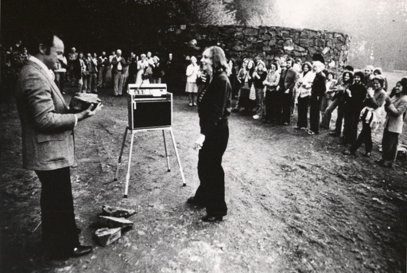 Nancy Holt speaks with then-WWU President Paul Olscamp at the 1978 dedication ceremony for "Stone Enclosure: Rock Rings" at Western Washington University. Courtesy photo