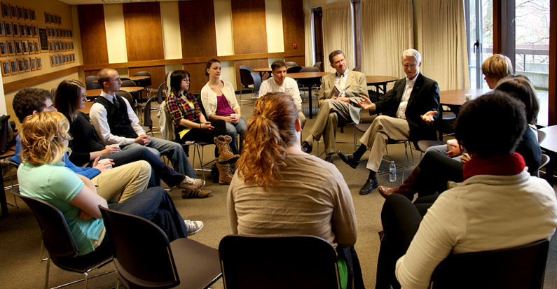 Washington Secretary of State Sam Reed, seated to Western Washington University President Bruce Shepard's left, chats with WWU students Wednesday morning as part of his week-long college civics tour. Photo by David Gonzales | University Communications int