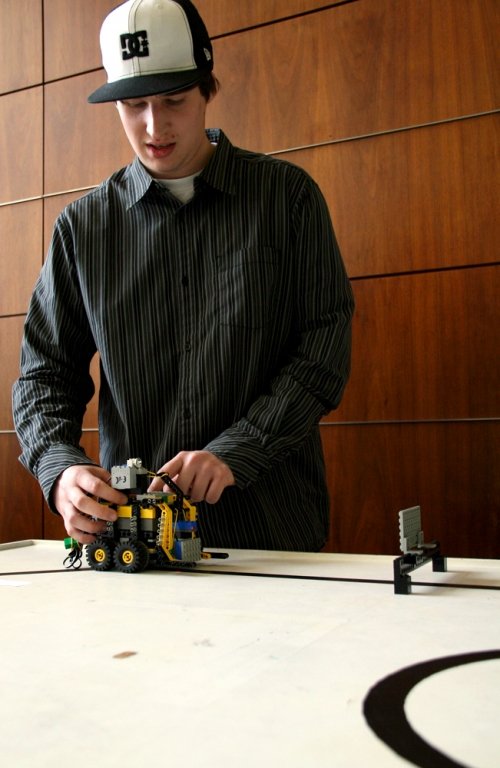 Scott Portman's "MoverBot" robot follows lines and moves obstacles in its way. Photo by David Gonzales | University Communications intern