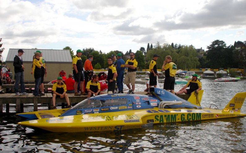 The winning boat, the UL-14 Sammamish Mortgage/WWU College Engineering Tech, driven by Paul Becker, after the Graham Trucking Unlimited Lights final. Standing near the boat are a handful of WWU students who were members of the boat's pit crew. Photo court