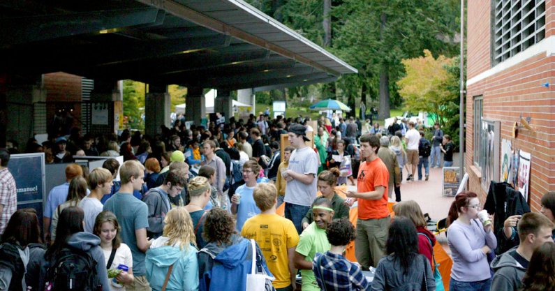 Western Washington University students pack the Vendor's Row area in front of the Viking Union during the annual Red Square Info Fair on Sept. 20. The fair was moved on Monday because of the rain. Photo by Matthew Anderson | University Communications