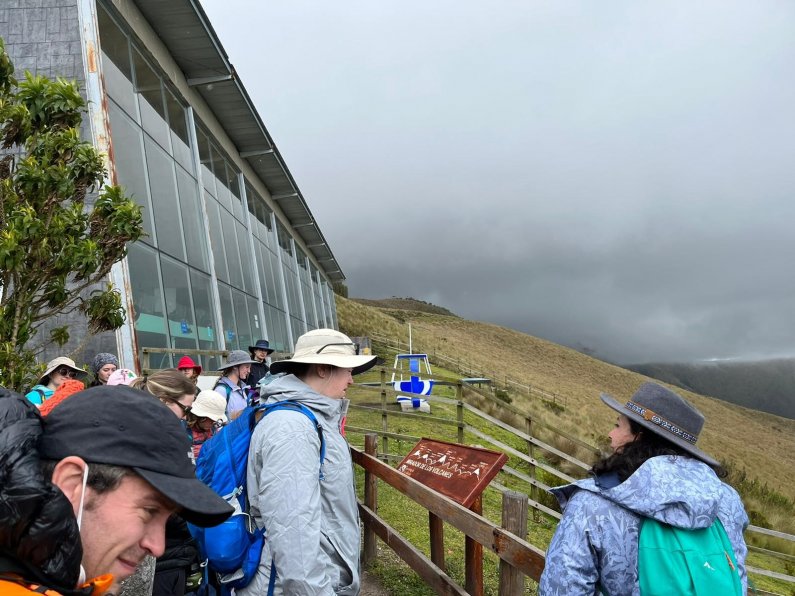Students look out over the mountainside at Teleférico on the slopes of the Pichincha Volcano