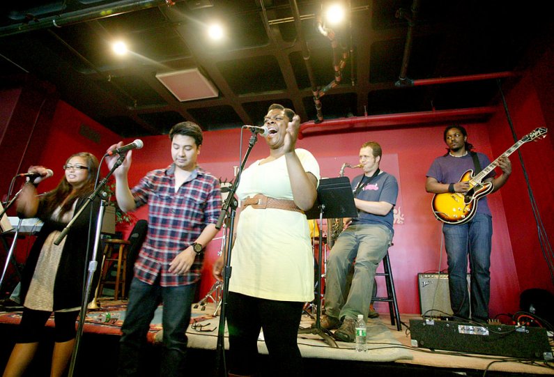 Rashawn Scott provides vocals for The Prime Time Band during the group's summer noon concert Wednesday, July 20, in the Underground Coffeehouse at Western Washington University. Photo by Matthew Anderson | WWU