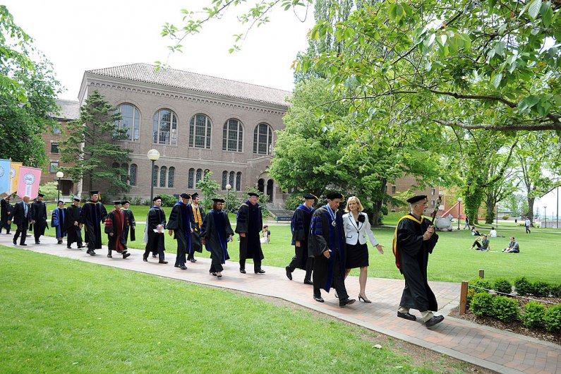 Faculty, staff and graduates, led by WWU president Bruce Shepard and his wife, Cyndie, take part in Memory Walk during commencement exercises June 11, 2011, at WWU. Photo by Dan Levine | for WWU