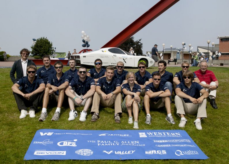 The WWU X PRIZE Team poses for a shot in front of their car, Viking 45, and the "For Handel" sculpture by Mark di Suvero.