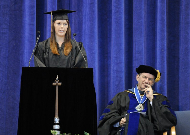 Graduating senior Sarah Olson, who received a Bachelor of Arts in Business Administration with concentrations in International Business and Management Information Systems, speaks at commencement. Photo by Dan Levine