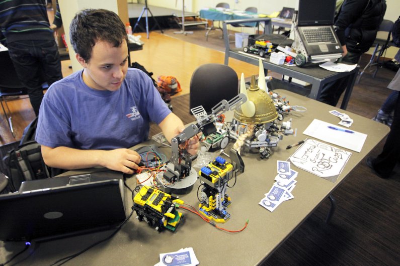 The campus activities showcase featured student clubs, academic programs and other community groups in the Viking Union Multipurpose Room on Tuesday, Feb. 1. Here, Western junior Ryan Bahm showcases robots and other projects created by the Western robotic