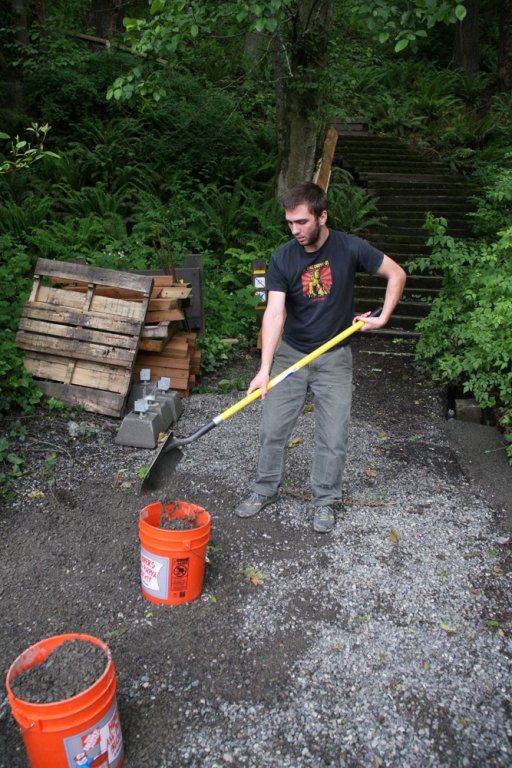 Ian Lucas, 21, an Environmental Studies major at WWU, shovels gravel into 5-gallon buckets in front of the site of a second stairway to be built by the 2010 fall block of Geology 417D, Outdoor Science Learning Resources. Photo by David Gonzales | Universi
