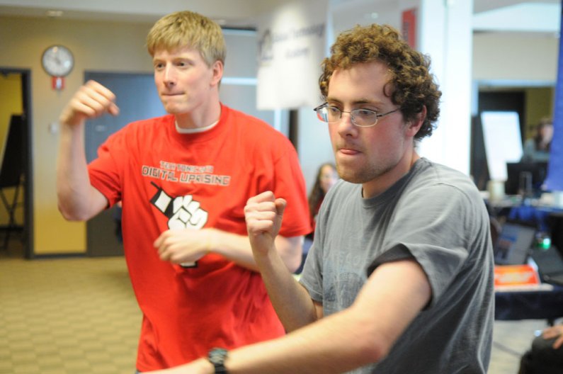Two students try out a boxing game for the Microsoft Kinect during the Techtonic 2011 Digital Uprising event Friday, May 6 in V.U. 565. The event brought national technology and electronics companies such as Adobe, Apple, Dell, HP and Microsoft  to Wester