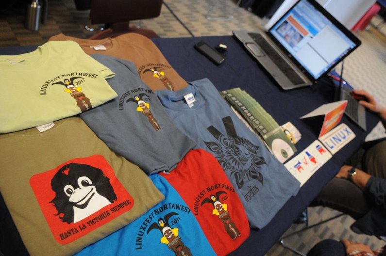 Linux-related shirts and merchandise on display at the Techtonic 2011 Digital Uprising event Friday, May 6 in V.U. 565. The event brought national technology and electronics companies such as Adobe, Apple, Dell, HP and Microsoft  to Western for a day of d