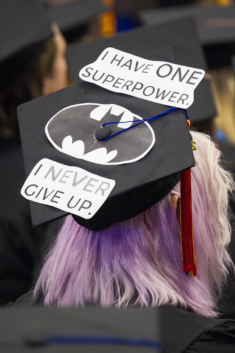 Mortarboard message: "I have one superpower. I never give up." 