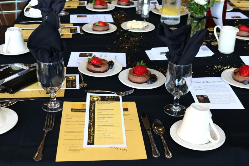 Each table is set with programs of the nights’ events along with biographies of the Voices of Hope Panelists. The dinner was buffet style with a decadent chocolate dessert placed on each table. 