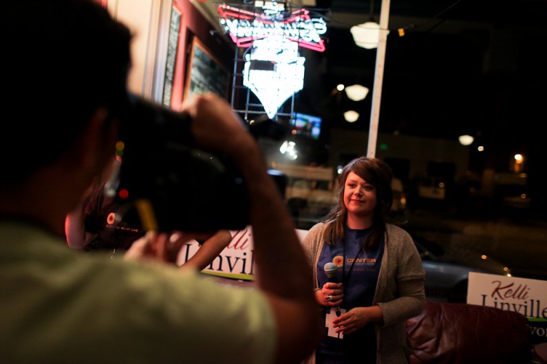 Anchor Tyler Maloy, a Whatcom Community College student, waits as the camera shot is setup for her interviews with mayoral candidate Kelly Linville and other Bellingham residents at the Copper Hog in Bellingham.