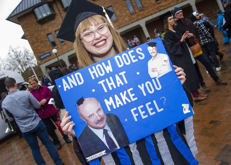 Student holds funny "Dr. Phil" poster in Red Square