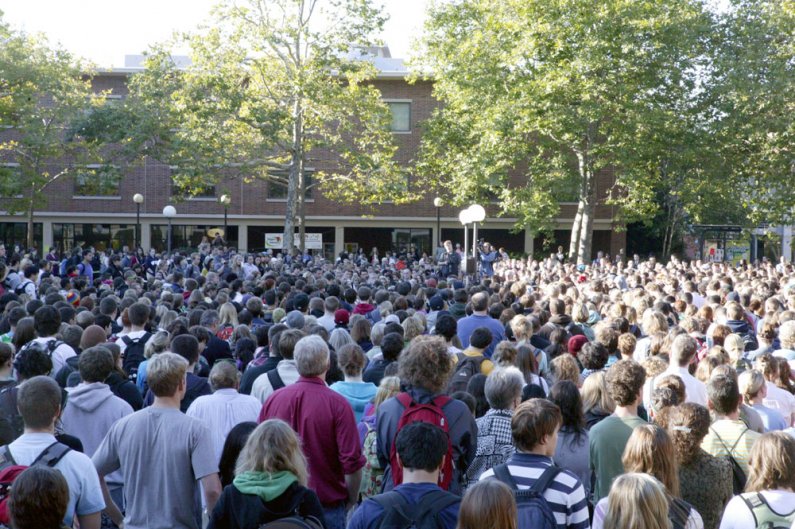Students, faculty, staff and community members gather in close to hear Eileen Coughlin, WWU's vice president for Academic Affairs and Student Support Services, address the crowd during a gathering for Dwight Clark on Wednesday, Oct. 6, in Red Square. Phot