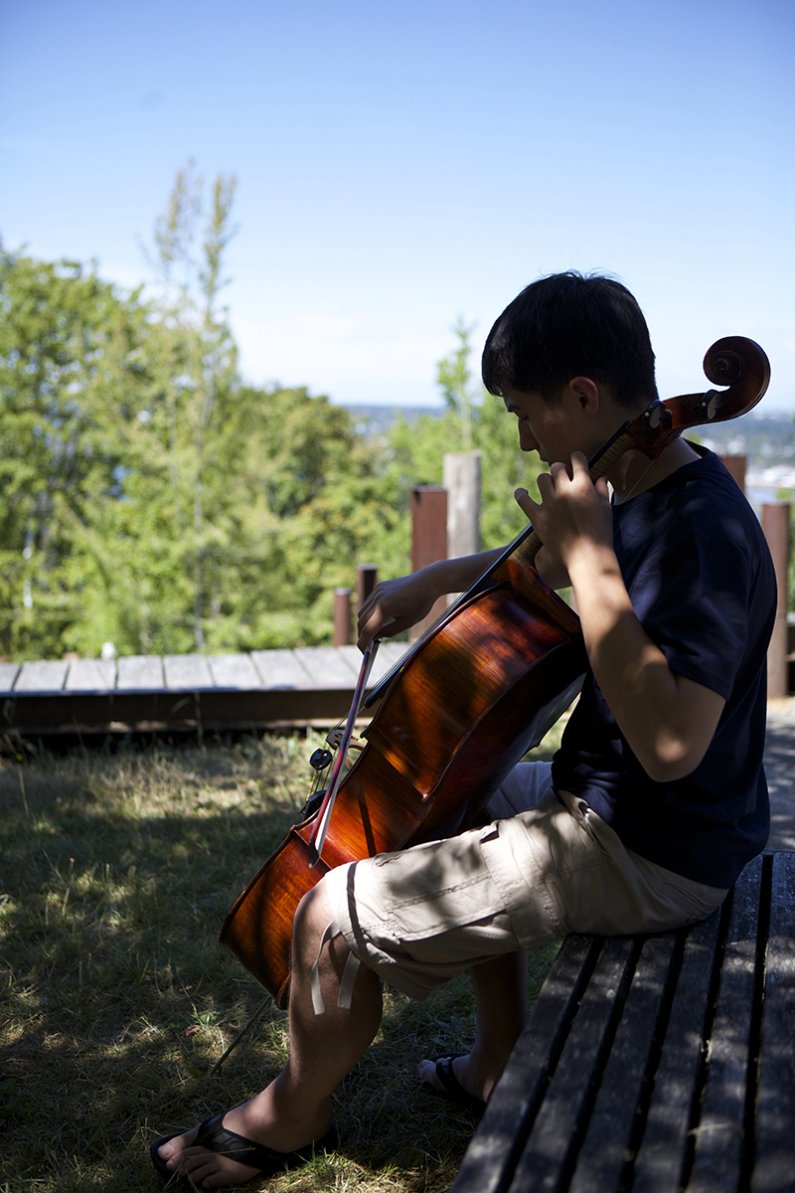 Jonathan Kuntz, practices the cello behind the Performing Arts Center on Tuesday, July 28.

Photo by Alexandra Bartick
