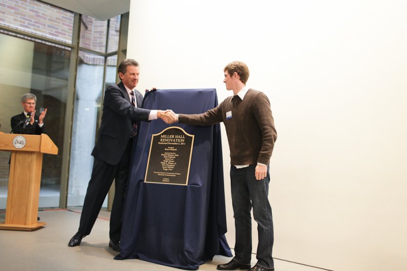 WWU President Bruce Shepard and ASVP for Business and Operations Travis Peters unveil the plaque in honor of the newly renovated Miller Hall Wednesday, Nov. 2, 2011. 