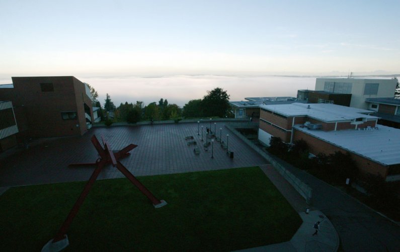 Morning fog blankets Bellingham Bay in this view from Special Collections on the sixth floor of Wilson Library on Wednesday, Oct. 6. Photo by Matthew Anderson | University Communications