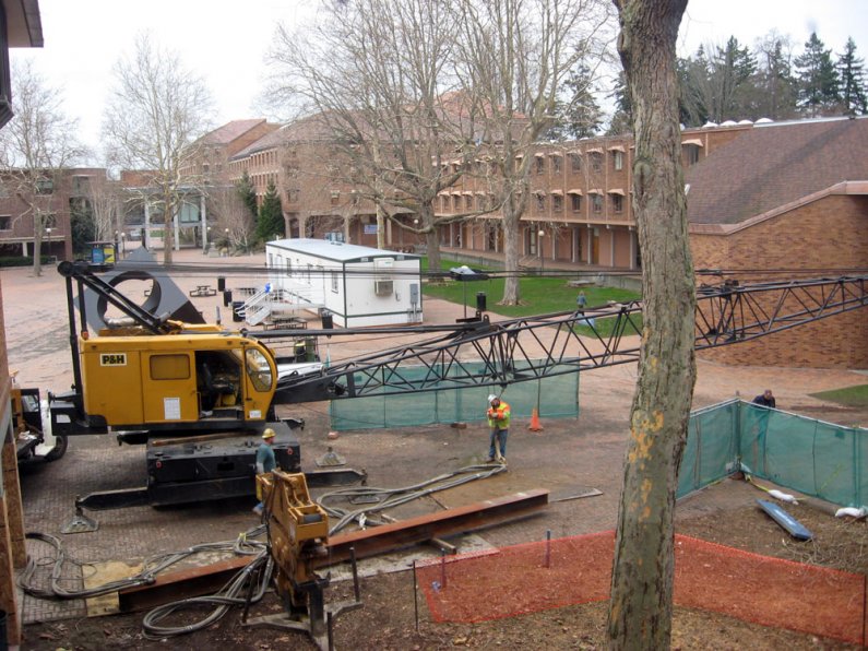 Workers install pilings for a new stairwell in Miller Hall on Dec. 17. Photo by Debra Sams | WWU