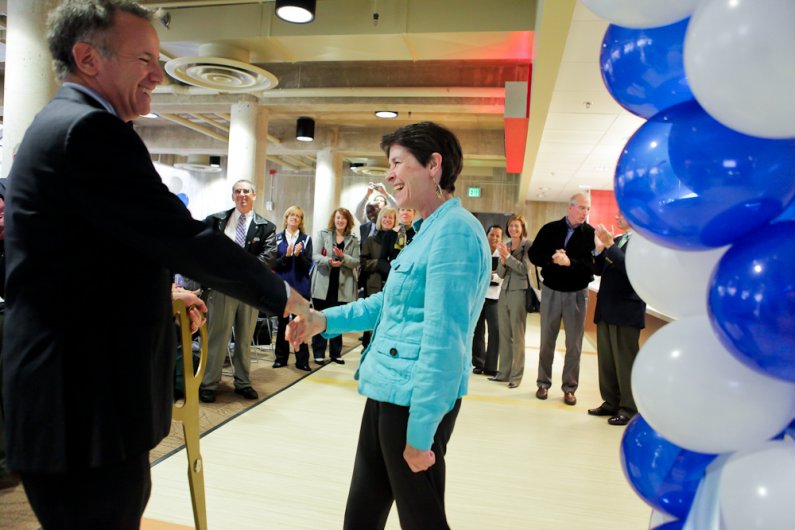 Eileen Coughlin, senior vice president and vice president for Enrollment and Student Services at Western and Aramark regional VP Chris Gossard share a laugh after making the ceremonial cut for the grand opening of the newly expanded student spaces in The 