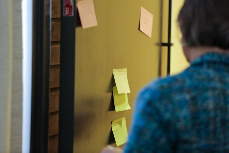 Audience members are encouraged to write a suggestion for environmental discussion topics they’d like to see on sticky notes during a breakout session at the Washington Higher Education Sustainability Conference at Western Washington University, Friday Fe