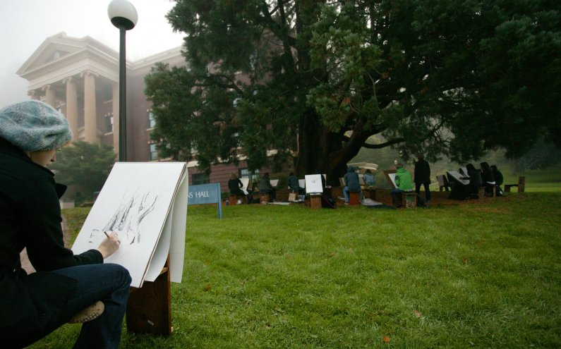 Victoria Walker, a freshman in assistant professor of art Cynthia Camin's beginning drawing class, sketches the large sequoia tree near Edens Hall Thursday morning, Sept. 30. Photo by Matthew Anderson | University Communications