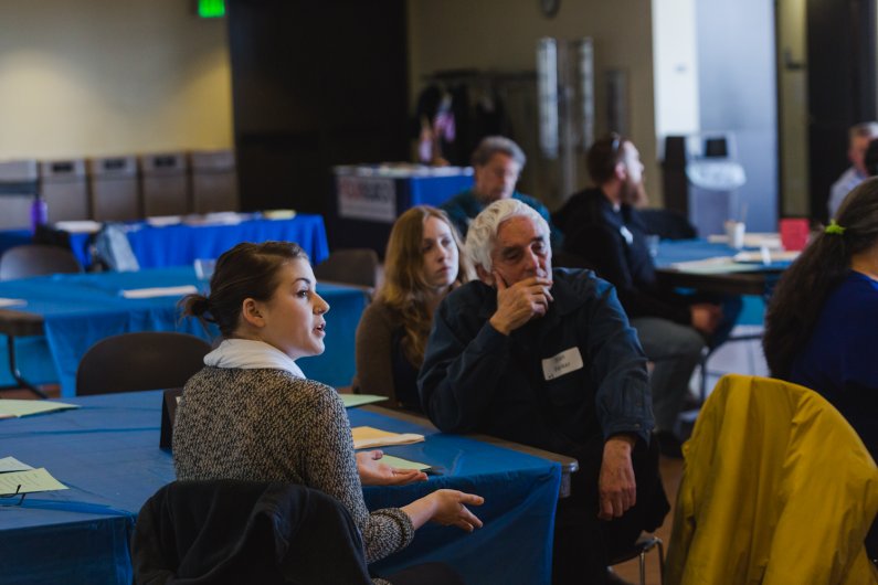 Attendees of a summit aimed at addressing the needs of Whatcom County veterans discuss possible solutions Tuesday, March 22, in the Viking Union Multipurpose Room at WWU. Photo by Rhys Logan / WWU