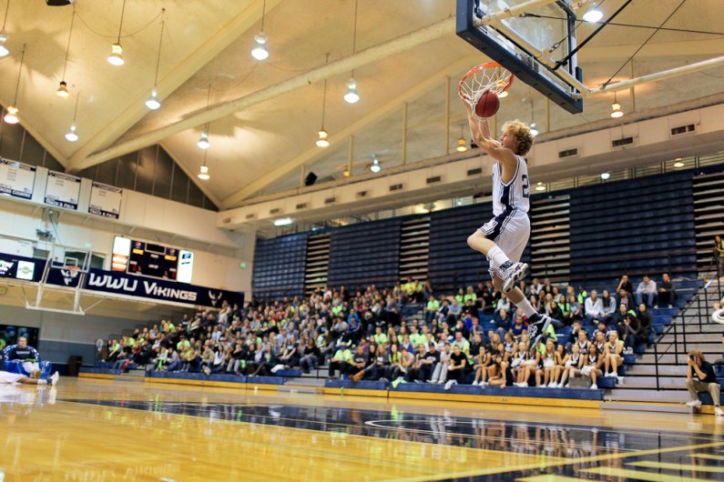 WWU basketball player Bryce McPhee throws down a reverse jam in the slam dunk contest during the Viking Jam at Carver Gym on Wednesday, Oct. 26, 2011. Photo by Rhys Logan | University Communications intern