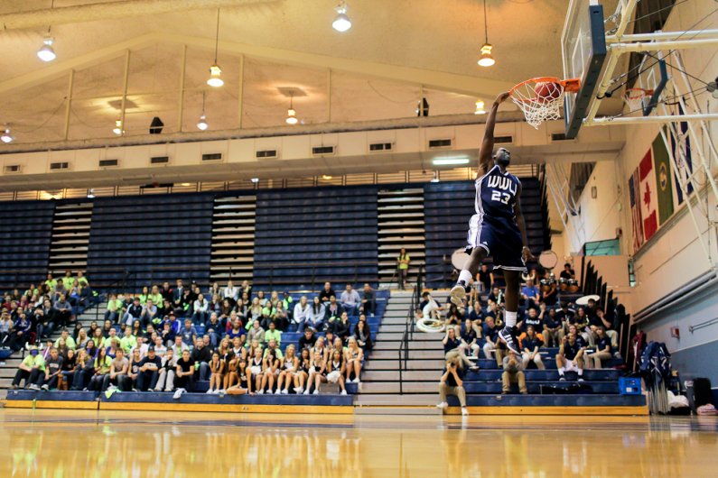 WWU basketball player Shedrick Nelson slams down a one-handed jam during the Viking Jam at Carver Gym on Wednesday, Oct. 26, 2011. Photo by Rhys Logan | University Communications intern