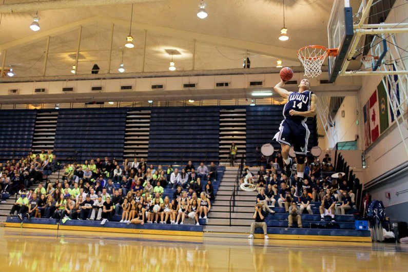 WWU basketball player Richard Woodsworth leaps for the win during the slam dunk contest that took place as part of Viking Jam at Carver Gym on Wednesday, Oct. 26, 2011. Photo by Rhys Logan | University Communications intern