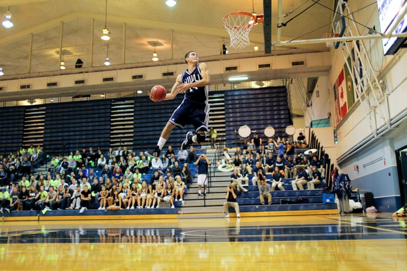 WWU basketball player Richard Woodsworth leaps for the win during the slam dunk contest that took place as part of Viking Jam at Carver Gym on Wednesday, Oct. 26, 2011. Photo by Rhys Logan | University Communications intern