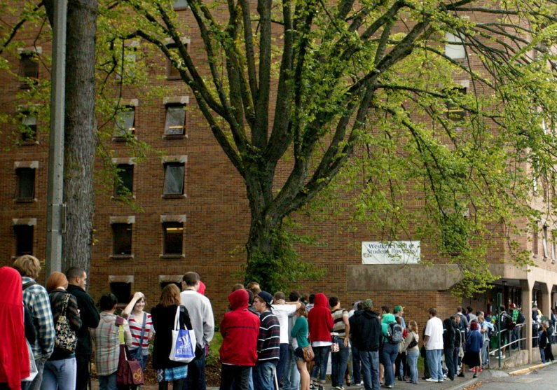 Western Washington University students wait in line for their Western Cards and Whatcom Transportation Authority bus passes along High Street on Monday, Sept. 20, 2010. Photo by Matthew Anderson | University Communications