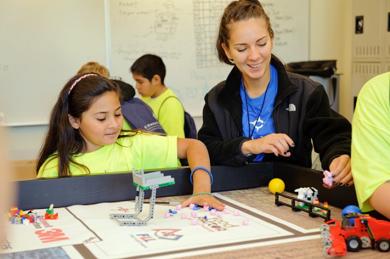 WWU student Crystal Mendoza, right, helps Stephanie Diaz play with robots during associate professor Jianna Zhang's robotics class during Compass 2 Campus on October 25, 2011. Photo by Rachel Bayne | For WWU