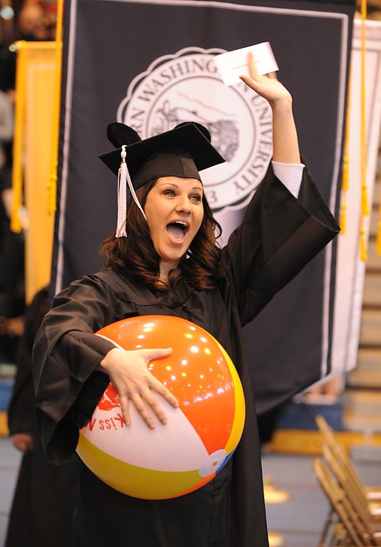 Tammy Statkus waves to family and friends as she enters Western Washington University's 2010 Winter Commencement.

Photo by Rachel Bayne of Bayne Photography | for WWU