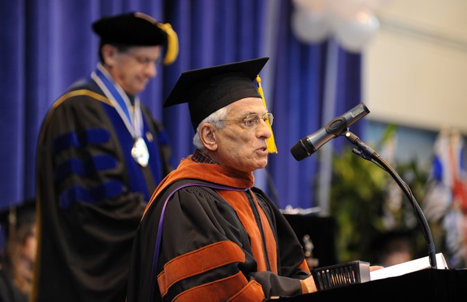 The Dean of the Graduate School, Moheb Ghali, tells President Bruce Shepard, behind, that the graduate degree candidates have met the requirements for their specific degrees, during Western Washington University's 2010 Winter Commencement at Sam Carver Gy