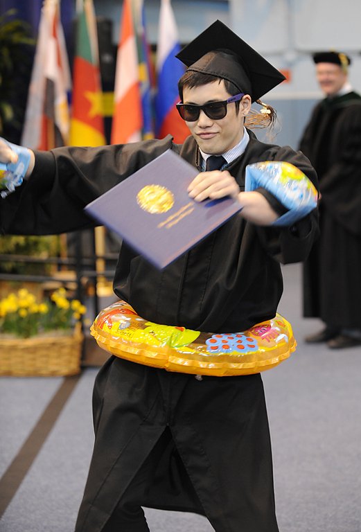Chris Kong dances while wearing "water wings" and a "float ring" after receiving his degree in business administration during Western Washington University's 2010 Winter Commencement at Sam Carver Gymnasium on March 20, 2010.


Photo by Rachel Bayne of