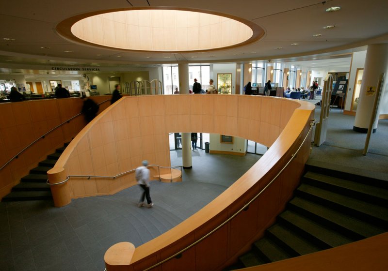Students make their way up the oval staircase in Haggard to the library's circulation desk.