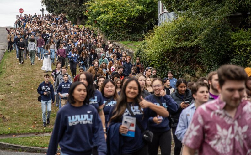 Thousands of WWU students seen marching downhill from WWU's Bellingham campus to the First Night Out event in downtown Bellingham