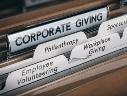  Photo of files in a folder, with labels reading "Corporate Giving," "Employee Volunteering," "Philanthropy," "Workplace Giving," "Sponsorship," and "Cause-related Marketing."