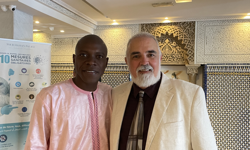 Christopher Wise stands with Amibibé Ouologuem at a conference in Rabat, Morocco