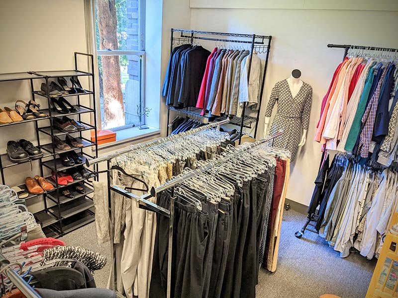 Racks of clothes and shoes inside the Career Closet