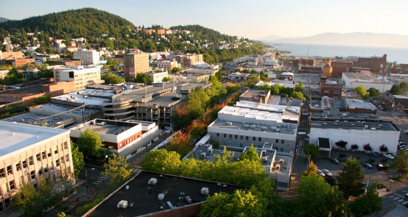 Downtown Bellingham, with the Western Washington University campus in the background on Sehome Hill. Photo by Joshua Parrish | WWU