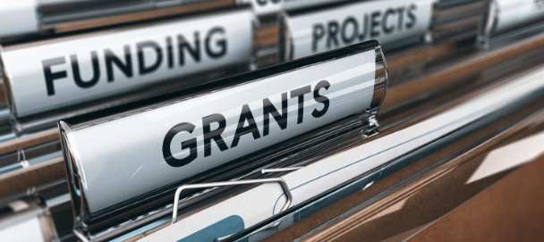 File folders are labelled "grants" and "funding"