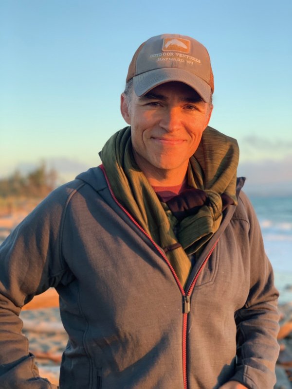 Paul Dunn smiles at the camera in this sunset shot at a local beach