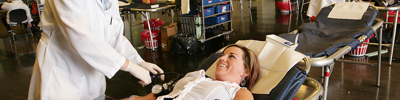 Liane Whitman, left, of Puget Sound Blood Center, prepares Katie Rothenberg, the assistant marketing director for the WWU Athletics Department, for her blood donation at the Viking Union Multipurpose Room, on April 22, 2009. Blood donation stations in Red