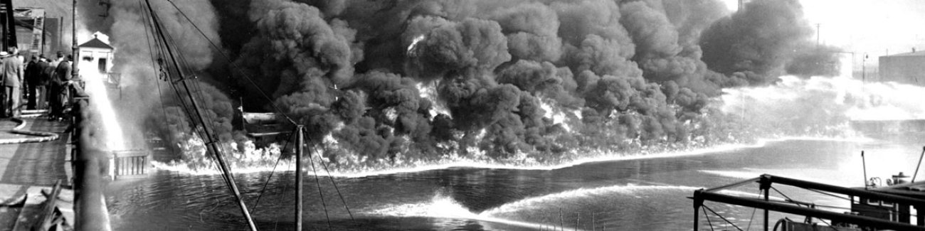 Cleveland's Cuyahoga River burns in 1969 as fire crews scramble to put out the blaze